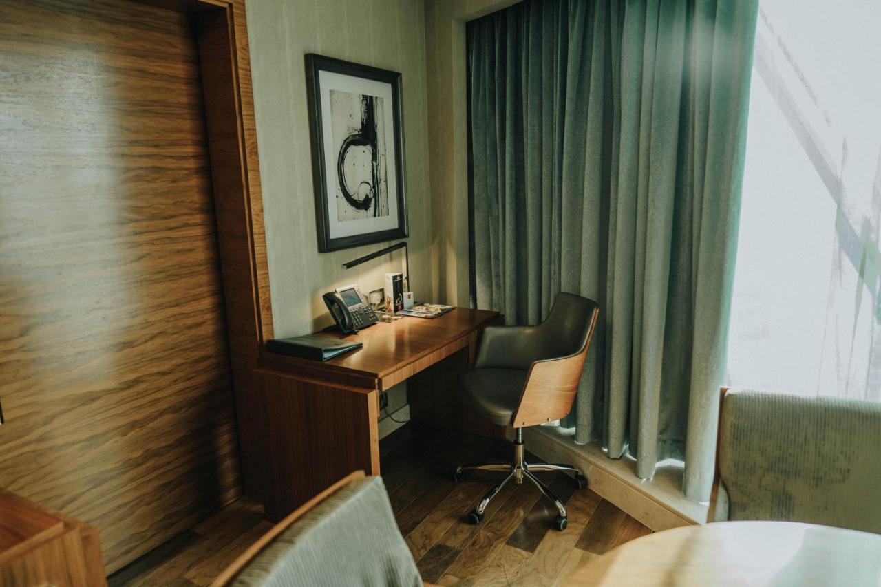 Grand Millennium Sulaimani Hotel Sulaymaniyah Exterior photo A room at the hotel