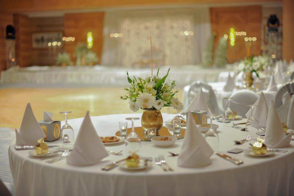 Grand Millennium Sulaimani Hotel Sulaymaniyah Exterior photo A table set for a formal dinner